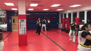 Adults training on pads in kickboxing class at Tiger Schulmann s Martial Arts of Stamford Ct