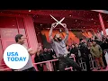 Post Malone unveils Raising Cane s restaurant custom-designed USA TODAY