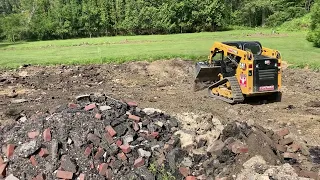 CAT 239D doing dirt work