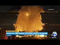 Massive fire burns through historic hangar in Tustin