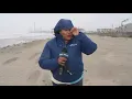 Reporter fights wind in live TV report from Galveston beach
