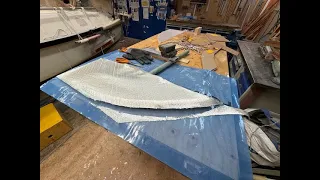 Laminating starbord side of deck house and rudder.