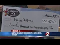Handyman Ace Hardware presents check to Dayton Children s