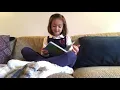 Jerah reads “Butterfly and Frog”