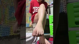 Asian girl in t-shirt and panties morning tease cross leg pose