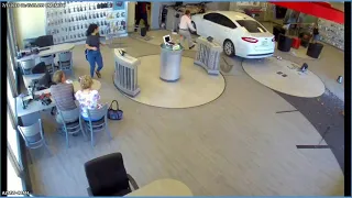 shows driver plowing into Verizon store in Tempe
