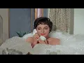 Joan Collins smoking cigarette in The Opposite Sex