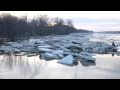 Despite receding water levels onlookers line banks of the Maumee