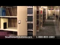 Library Shelving on Wheels Rolls on Tracks Turning Aisles into Storage Space