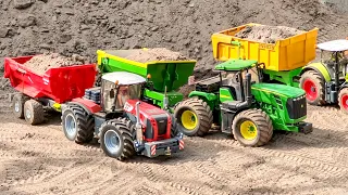 MEGA TRACTORS, RC TRUCKS AND LOADERS AT THE SITE
