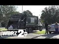 Man ticketed after pinning Baton Rouge worker against garbage truck in Thursday morning crash