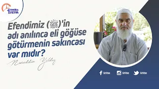 Efendimiz (ﷺ)'in adı anılınca eli göğüse götürmenin sakıncası var mıdır?