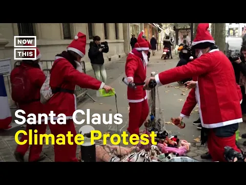 Download MP3 Extinction Rebellion Activists Protest Wearing Santa Claus Costumes