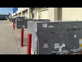 Lots of commercial packaged RTU air conditioners at an outlet mall in Williamsburg Iowa Part 3