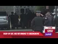 Body of Sgt Nix arrives at the funeral home in Greensboro