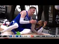 Isaiah Hartenstein goes to help up Paul George and falls on him