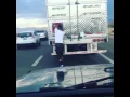 Man removes Confederate battle flag off a truck in the middle of traffic