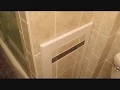 Ceramic tile access panel for bathtub plumbing