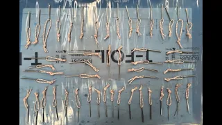 Epoxying the knots of the Tails for the cotter pins that secure the lids of the storage compartments