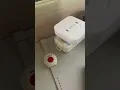 A four-step demonstration of pairing the watch s emergency button with the receiver CallToU