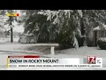 Checking out the snow in Rocky Mount