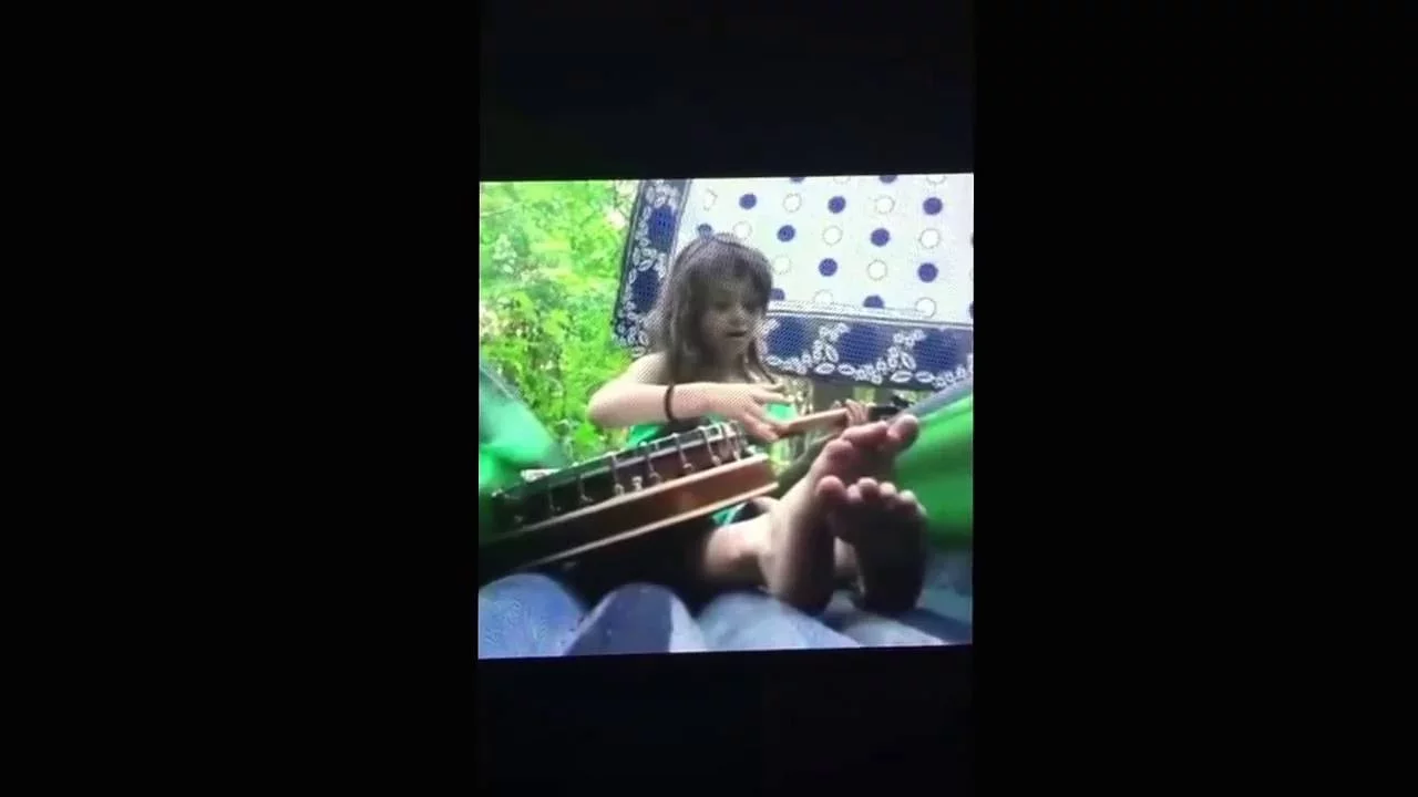 Granddaughter totally freestyles on the Banjo while camping out in Ohio.