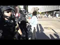Protesters briefly block traffic at the intersection in front of the Kent County Courthouse
