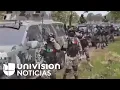 Dressed as soldiers and wielding rifles this is how alleged CJNG drug traffickers appear in a vi