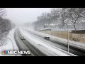 Dangerous road conditions and power outages as blizzard barrels up East Coast