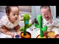 Download Lagu Babies play dancing cactus toy. Cutest baby funniest moments.