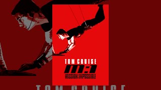 Tom Cruise as Ethan Hunt hanging from a ceiling in a suspenseful moment from the Mission: Impossible game