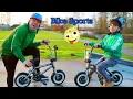 Jason and Alex play bike sports in park