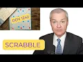 Man ruminates over candidate plays during Scrabble game
