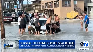 High surf from Hurricane Marie floods Seal Beach, fuels dangerous rip currents