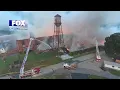 Crews may be battling fire at warehouse for several days