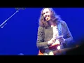 Hozier drawing a tattoo for a fan