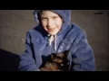 1963: Purple hoodie girl hugs cat kisses loves pet so very much. MOLINE, ILLINOIS