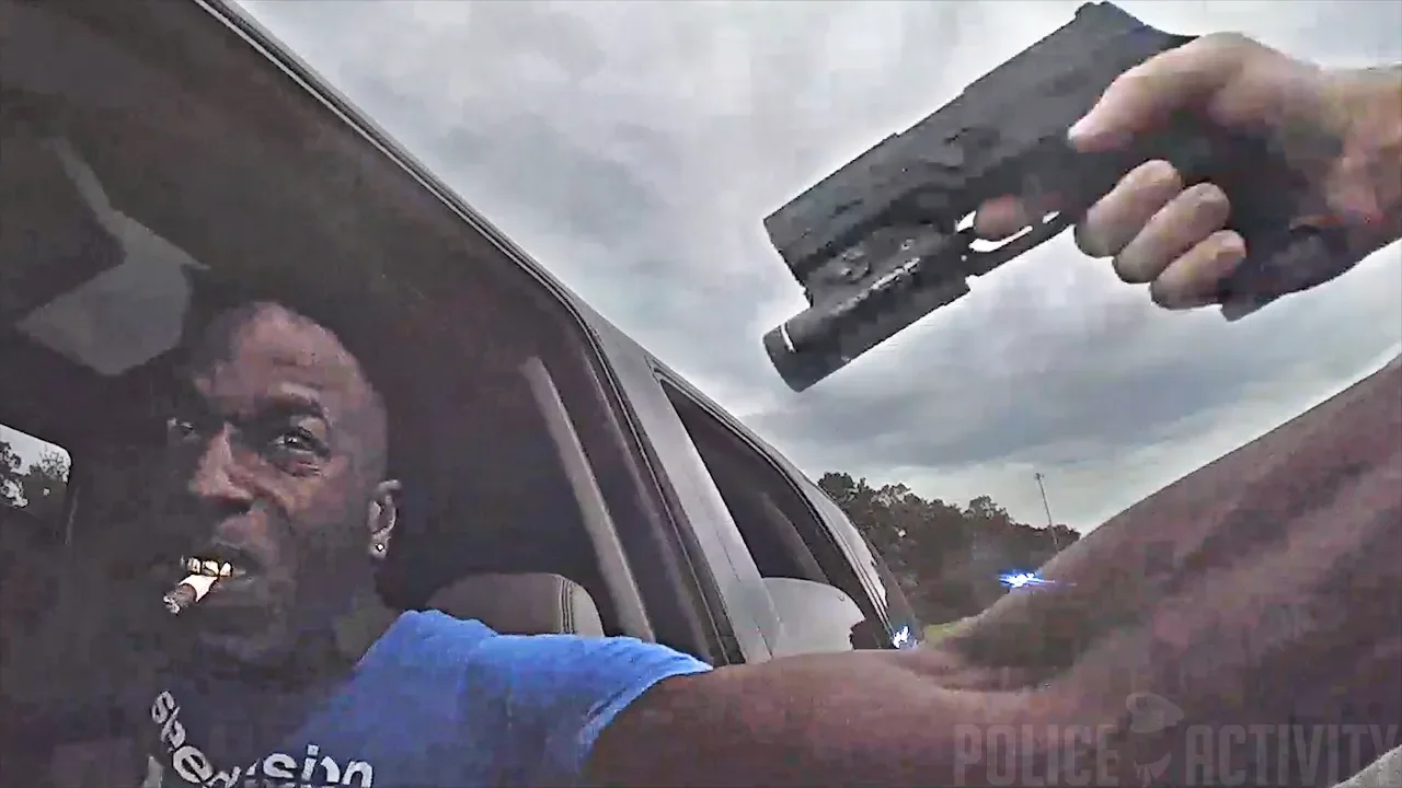 Bodycam Shows Deputy Hanging Onto SUV Before Shooting Driver