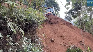 Newly Purchased JCB Backhoe Loader Levels out Freshly Cut Mountain Road