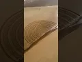 Artistic creativity with a rake drawings on the ground