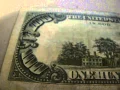 Checking out 1985 one hundred dollar bill