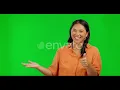Happy asian woman hands and thumbs up on green screen for success against a st Footage Stock