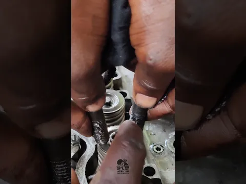 you don't have a valve spring compressor? do this insted