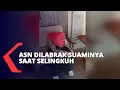 Lagu A civil servant was assaulted by her husband while she was with another man in a hotel room.