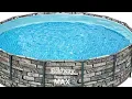 building above ground pool with a 12x12 deck and a garden bridge