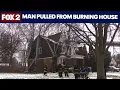 Man pulled from burning house in Detroit