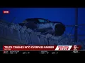 Truck left partially dangling over Interstate 93 overpass in Boston after crash