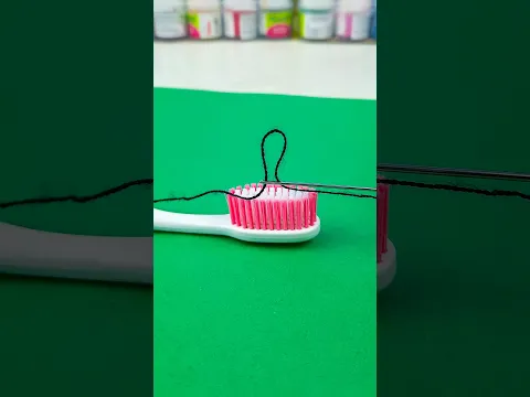 An excellent trick for threading a needle using a toothbrush