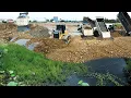 Nicely Large Ripples Landfill Using Dump Truck Discharge with Shantui DH17C3 Dozer Pushing Stones