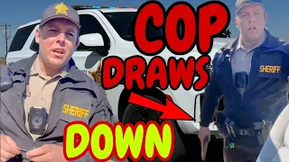 COP PULLS GUN FOR MUD FLAPS LAWSUIT